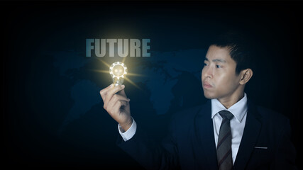 Businessman holding light bulb with a gear icon and virtual screen with word future. future innovation idea concept.