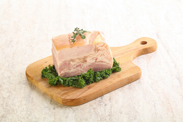 Cut of pork bacon over board