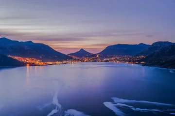 Foto auf Leinwand Long exposure shot of Hout Bay at night from Chapman's Peak Cape Town © Arnold