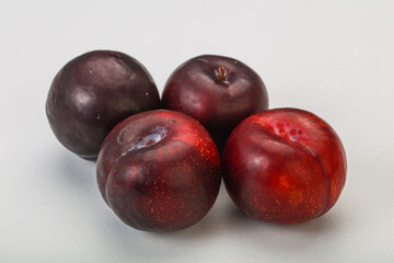 Ripe sweet plum fruit heap