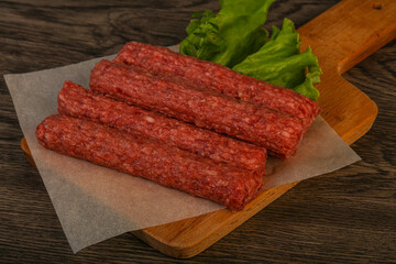 Raw beef sausages with spices