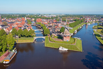 Aerial view on Dokkum with windmills Zeldenrust and De Hoop in the Netherlands