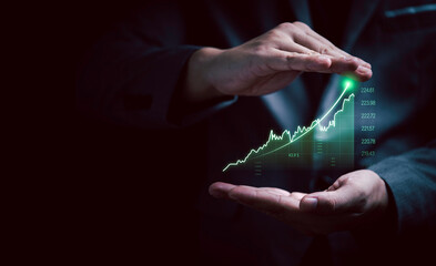 Businessman gesture protecting increasing virtual investment graph and chart for stock market...