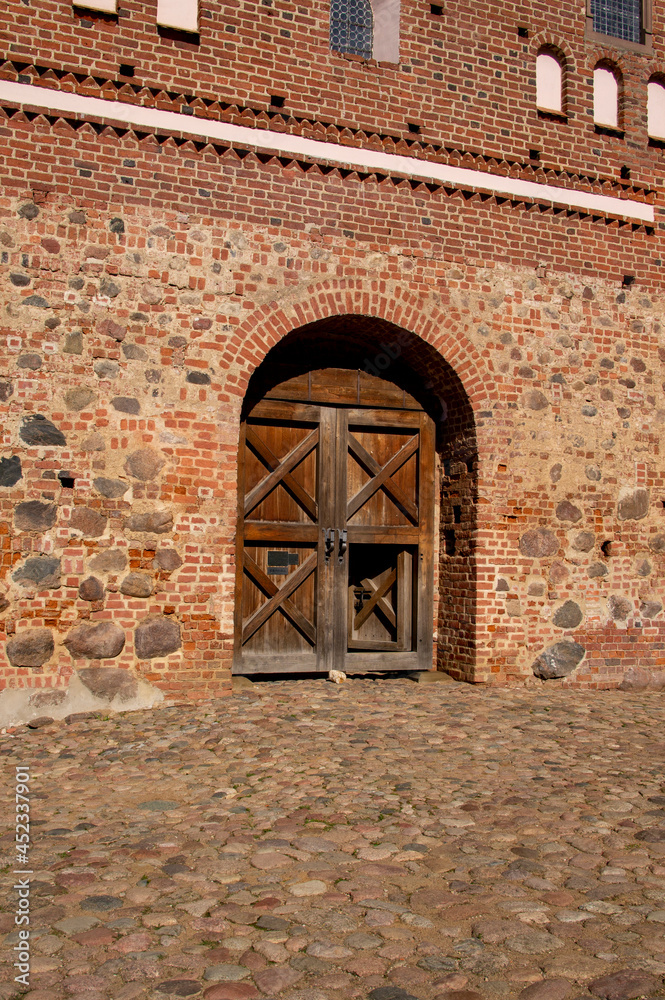 Wall mural Old beautiful architectural medieval castle gate