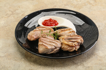 Grilled pork tenderlion with tomato sauce