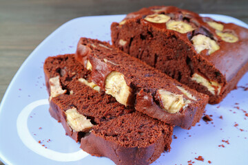 Slices of Mouthwatering Fresh Baked Homemade Dark Chocolate Banana Cake on a Plate