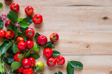 Fresh Acerola Cherry  on wooden background, top view image.
