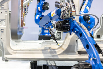 robot arm working in car factory