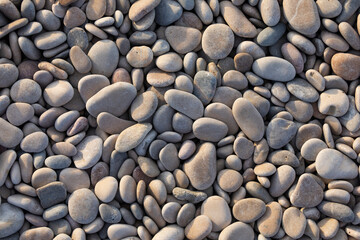 Texture of rounded stones, by the effect of the sea, of different sizes, Prat de Cabanes Natural Park, Torreblanca, Castellon, Spain