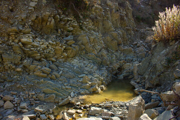 A dry river in a canyon in the mountains.