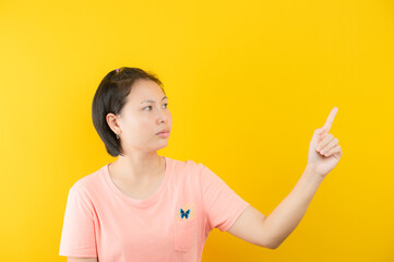 Closeup photo of amazing short hairdo lady looking up empty space deep thinking creative person arm on yellow color background