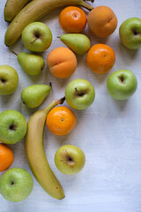 Assorted fruits on textured white