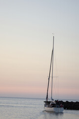 Luxury yachts sailing full speed from the harbor out to the ocean