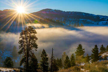 Sunburst over valley inversion fog © knowlesgallery