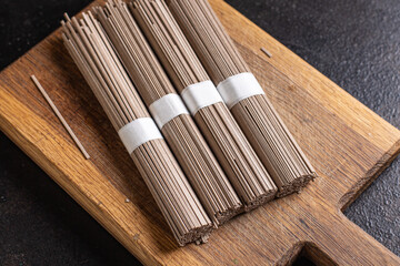 soba buckwheat noodles ready to cook portion meal snack on the table copy space food background rustic. top view keto or paleo diet veggie vegan or vegetarian food