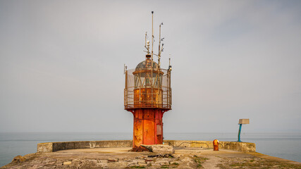 Fototapeta na wymiar The South Pier Lighthouse in Heysham Harbour, Lancashire, England, UK