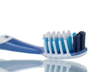 One toothbrush, close-up, isolated on white.