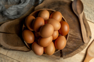 wooden plate with eggs on top of wooden board
