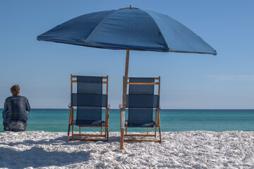 beach chair and umbrella on beach © Rachelle Yingling
