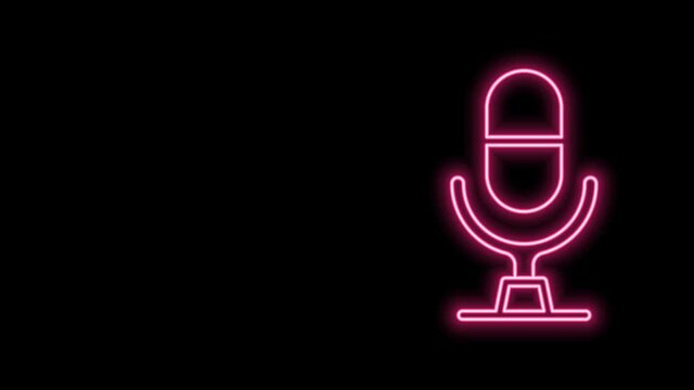 Glowing neon line Microphone voice device icon isolated on black background. Microphone interpreter and alphabet letters. 4K Video motion graphic animation
