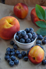 Naklejka na ściany i meble Colorful summer fresh fruits - nectarines, peaches and blueberries