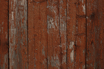 Background of textured wooden wall with brown peeling paint 