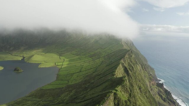 Aerial view of Caldeirao, a lake along the coastline on Corvo island, Azores islands, Portugal.