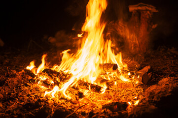 blurred campfire in the night. bonfire with a burning flame in the dark