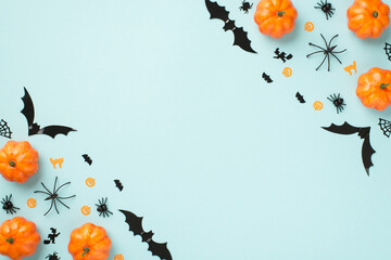 Top view photo of halloween decorations pumpkins spiders cobweb cat witch and bats silhouettes on...