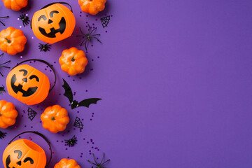 Top view photo of halloween decorations pumpkin baskets black sequins spiders web and bat silhouette on isolated violet background with empty space