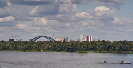 View of the Dnieper river. Podolsko-Voskresenskij Bridge. Kyiv, Ukraine.