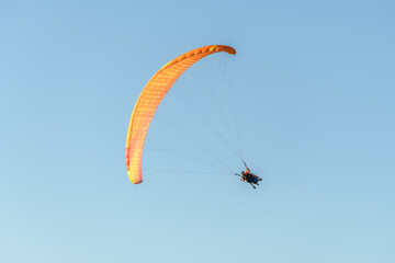 Paragliding flight in the air over the mountains.