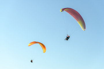 Paragliding flight in the air over the mountains.