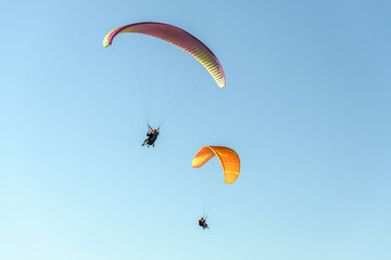 Paragliding flight in the air over the mountains.