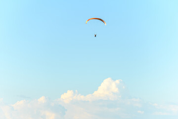 Paragliding flight in the air over the mountains.