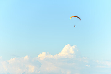 Paragliding flight in the air over the mountains.