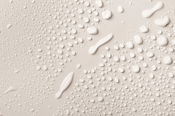 Water drops on smooth surface, white background