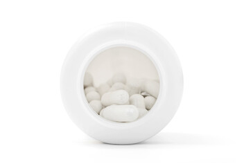 Fototapeta na wymiar White capsules inside opened supplement plastic bottle isolated on white background