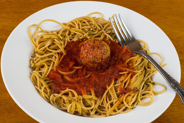 whole wheat  spaghetti  with a plant base meat  ball