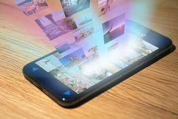 
Photos and images are displayed on a modern smartphone and streamed as a hologram beyond the...