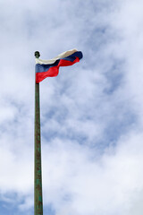 flag of the Russian federation (Russia) against cloudy sky