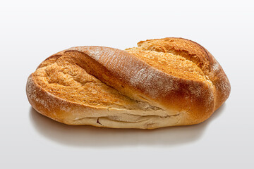 White homemade bread with a crispy crust on a light background