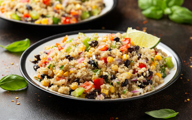 Quinoa black bean salad with corn, red green pepper, onion. Healthy food.