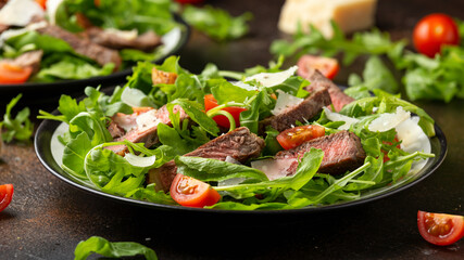 Italian Beef Tagliata salad with wild rocket, cherry tomatoes and parmesan cheese