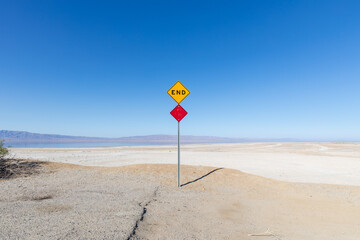 End of the road sign at Salton Sea in the desert.