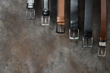Genuine and Faux leather belts concept, Brown and black leather for denim, linen or corduroy trousers, stylish belt
