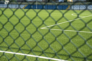 Closeup shot of a wire fence for a football soccer training field