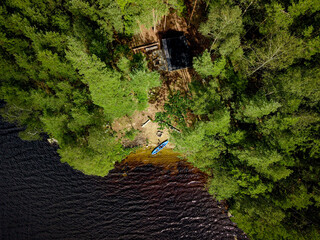 Aerial view of a lake shows how good it is to be close to nature during an outdoor adventure and canoe trip