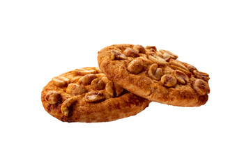 a couple of cookies with nuts and caramel isolated on white.