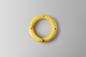 Creative concept zero waste. Bananas in the form of a round on a gray background.